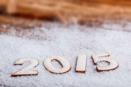 2015 year wooden figures on the snow backgroundの写真素材