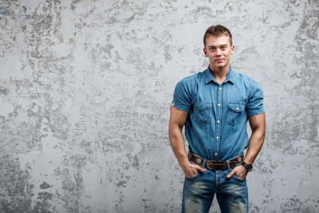 Handsome young man in jeansの写真素材