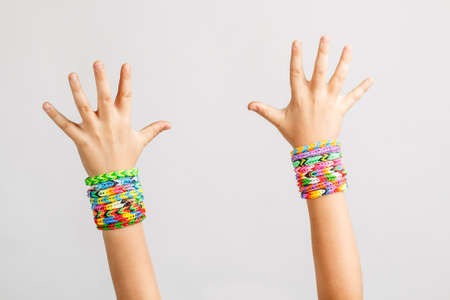 Loom bracelets on a young kid hand