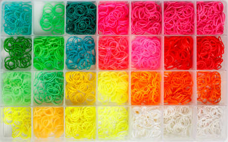Colorful rainbow loom rubber bands in a box