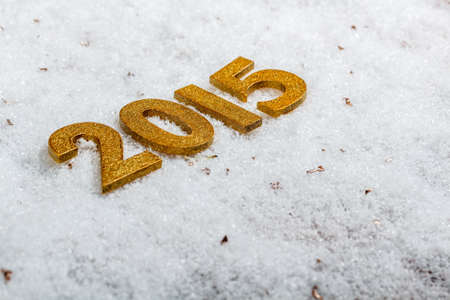 2015 year golden figures on the snow backgroundの写真素材