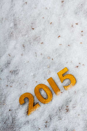 2015 year golden figures on snow backgroundの写真素材