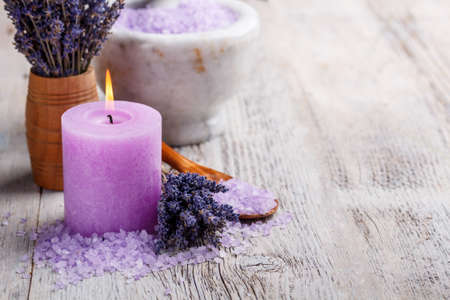 Aromatherapy concept, candle with lavender flowersの写真素材