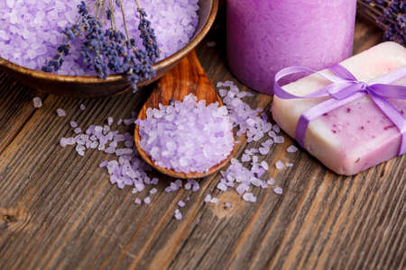 Lavender soap and salt on rustic wooden boardの写真素材