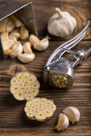 Garlic crushed and garlic pressの写真素材