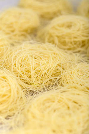 Italian filini pasta, raw food backgroundの写真素材