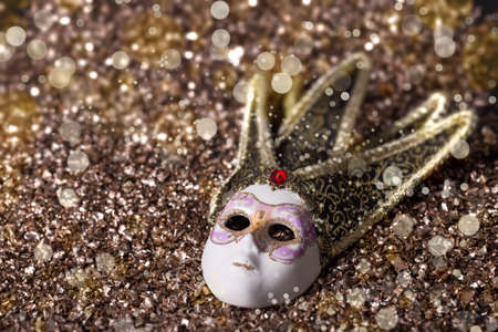 Female carnival mask with glittering backgroundの写真素材
