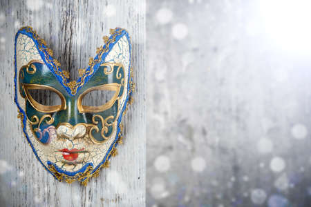 Carnival mask on wooden backgroundの写真素材
