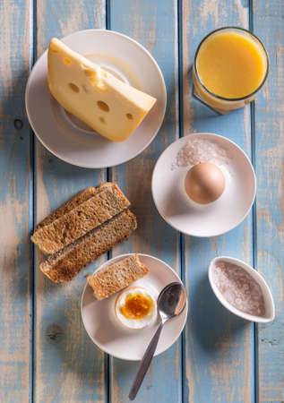Top view of breakfast on wooden board