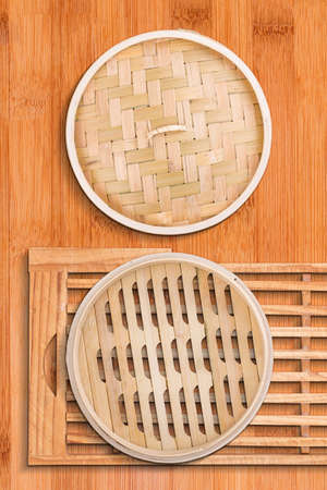 Traditional bamboo steamer on wooden backgroundの写真素材
