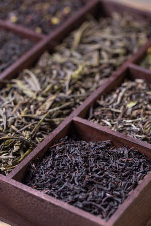 Close up of assortment of dry tea in wooden boxの写真素材
