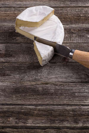 French camembert pieces served on woodの写真素材