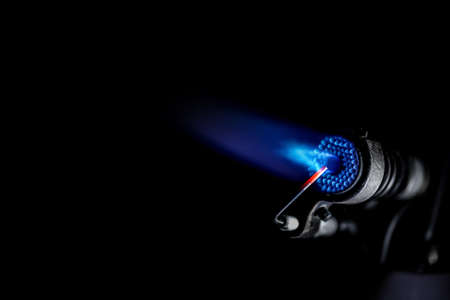 Industrial natural gas burner isolated on black backgroundの写真素材