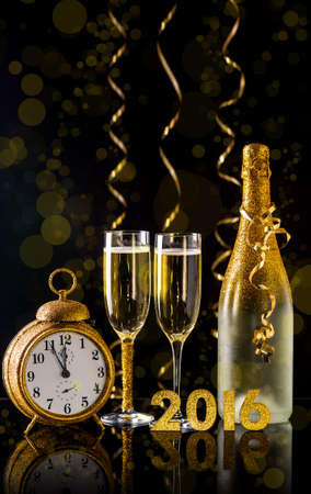 2016 New Year concept with two champagne glasses ready to bringの写真素材