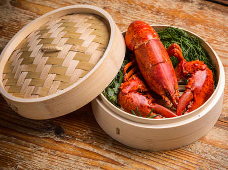 Fresh steamed lobster in bamboo steamer