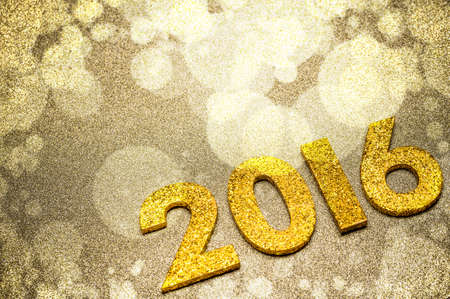 Golden number with 2016 on glitter background, new year template
