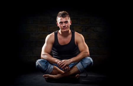 Casual young man looking at cameraの写真素材