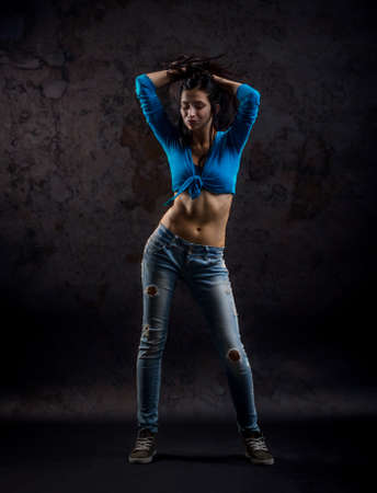 Studio shoot of active female dancer movingの写真素材