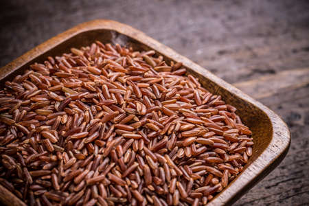 Close up of red rice in a wooden bowlの写真素材
