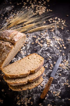 A loaf of bread on black background
