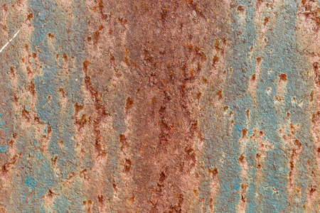 Rusty colored metal with cracked paint, grunge background