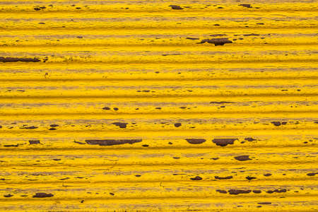 Rusty yellow metal surface texture backgroundの写真素材