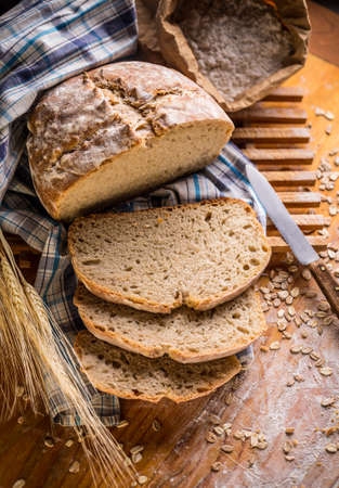 Fresh bread on rustic style background