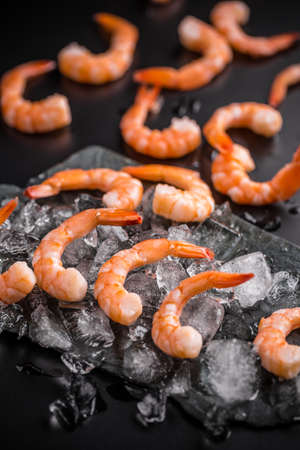Group of raw shrimps on iceの写真素材