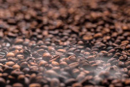 Coffee beans background with smokeの写真素材