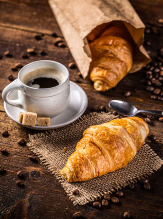 Croissant and coffee on vintage styleの写真素材
