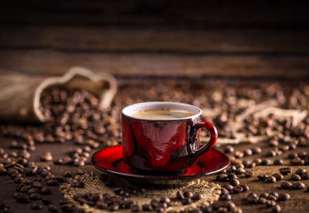 Coffee cup and saucer on a wooden tableの写真素材
