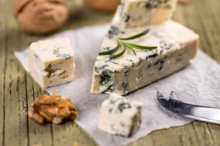Blue cheese on wooden backgroundの写真素材