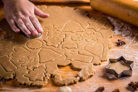 Gingerbread biscuits being cut outの写真素材