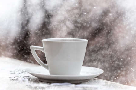 Hot tea cup on a frosty winter dayの写真素材