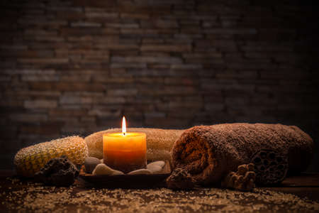 Aromatherapy candles with towel on dark backgroundの写真素材