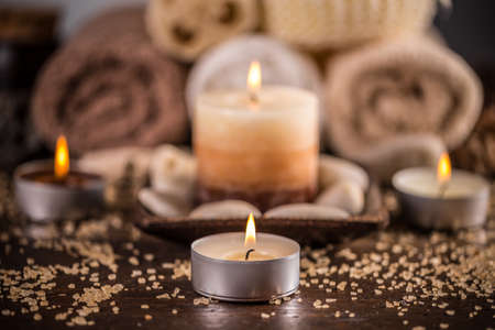 Spa still life with aromatic candles on wooden surfaceの写真素材