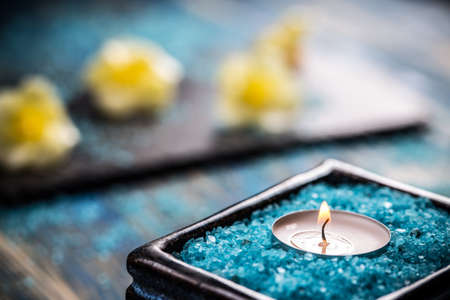 Spa background, candle in a bowl with salt bathsの写真素材