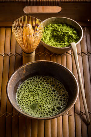 Organic green matcha tea in a bowl