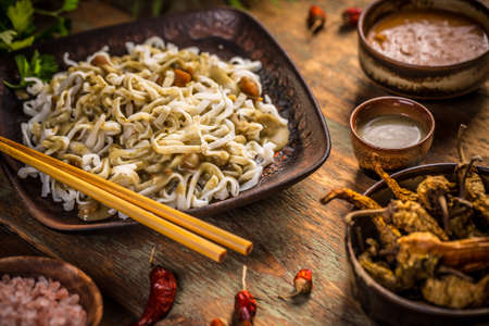 Thai noodles with green curry sauceの写真素材