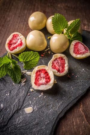 Dried strawberry coating by white chocolateの写真素材