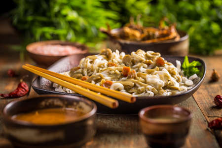 Thai noodles with green curry sauceの写真素材