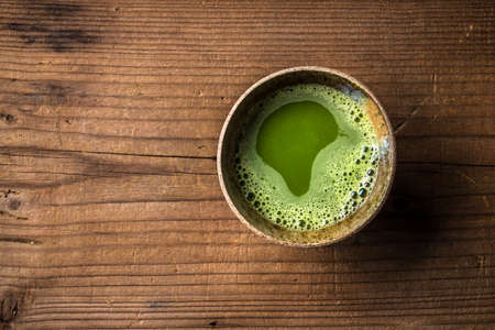 Top view of organic green matcha tea in a bowlの写真素材