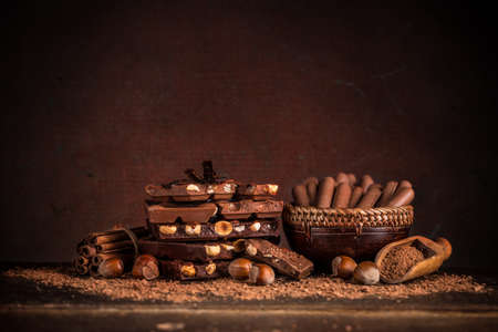 Still life with set of chocolates on wooden tableの写真素材