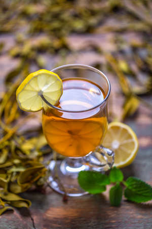 Cup of tea with mint and lemon
