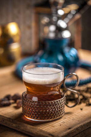 Cup of tea with antique glass-holderの写真素材