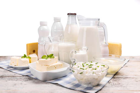 Dairy products on old wooden tableの写真素材