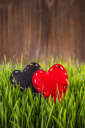 Hand crafted red and black felt heartsの写真素材