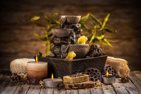 Tranquil spa relaxation setting with small water fountainの写真素材