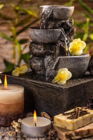 Composition of spa treatment with pouring water fountainの写真素材