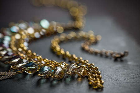 Close up of metal feminine necklace with stonesの写真素材